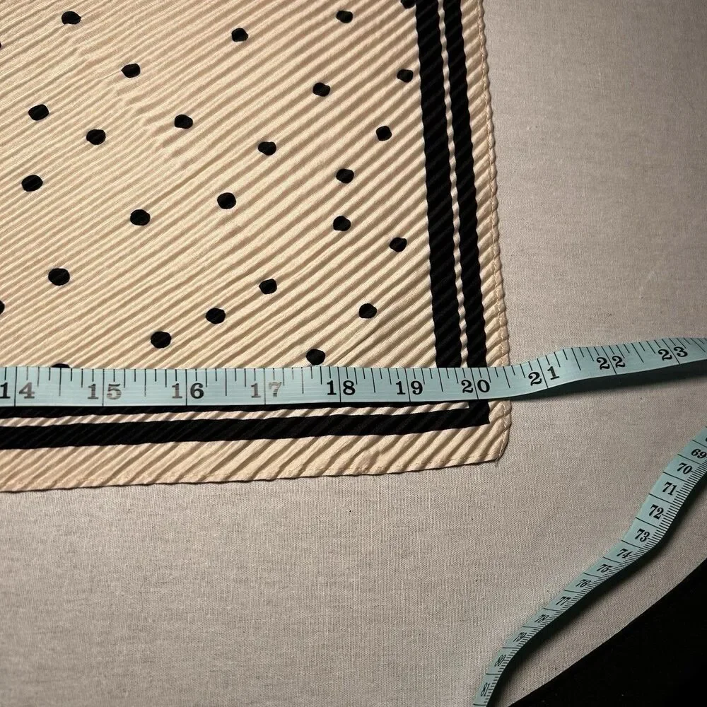 Reserved cream polka dot scarf, bold black border, pleated texture
